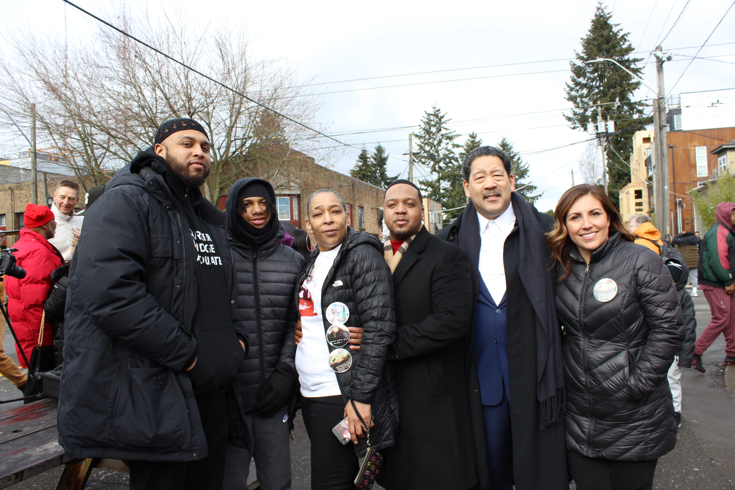 Mayor Harrell and Councilmember Mosqueda psoe with members of the Pickett family at the street renaming ceremony.