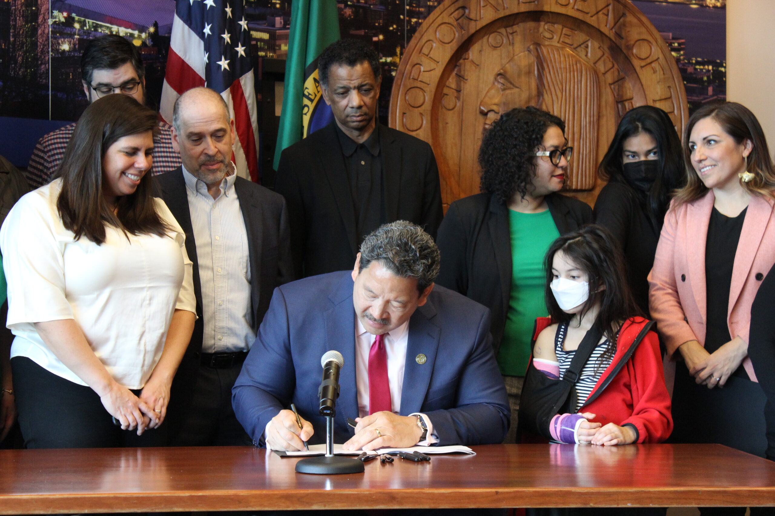Mayor Harrell signs the legislation