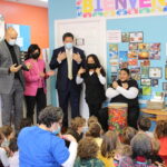 Mayor Harrell and Councilmember Morales participate in a call and response song with students at La Escuelita.