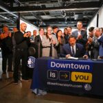 Mayor Harrell signs Downtown Activation legislation with community members