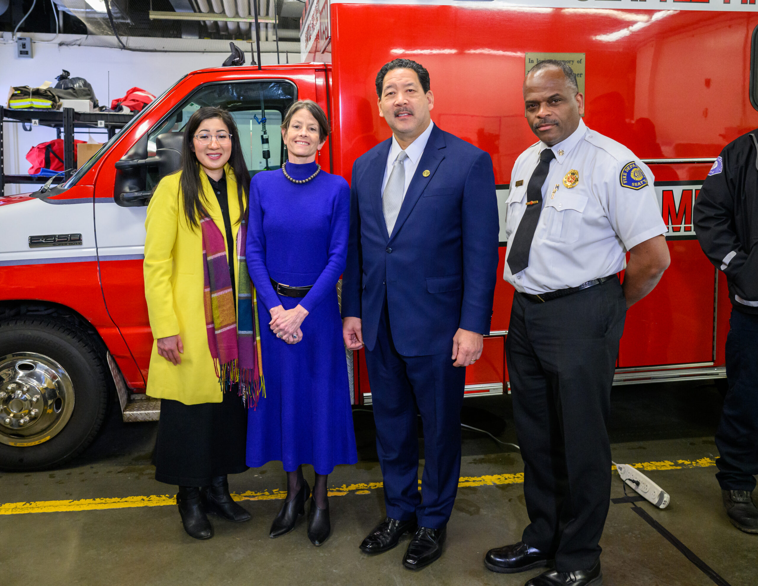 Mayor Harrell stands with Councilmember Tanya Woo, Council president Sara Nelson, and Fire Chief Scoggins