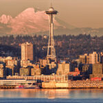 Seattle skyline with Space Needle and snow covered mountains