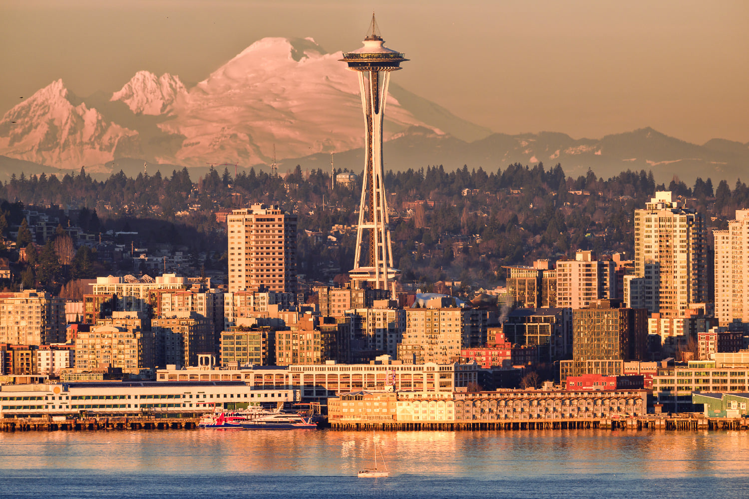 Seattle skyline with Space Needle and snow covered mountains