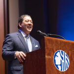 Mayor Harrell smiles as he gives the State of the City address at Benaroya Hall