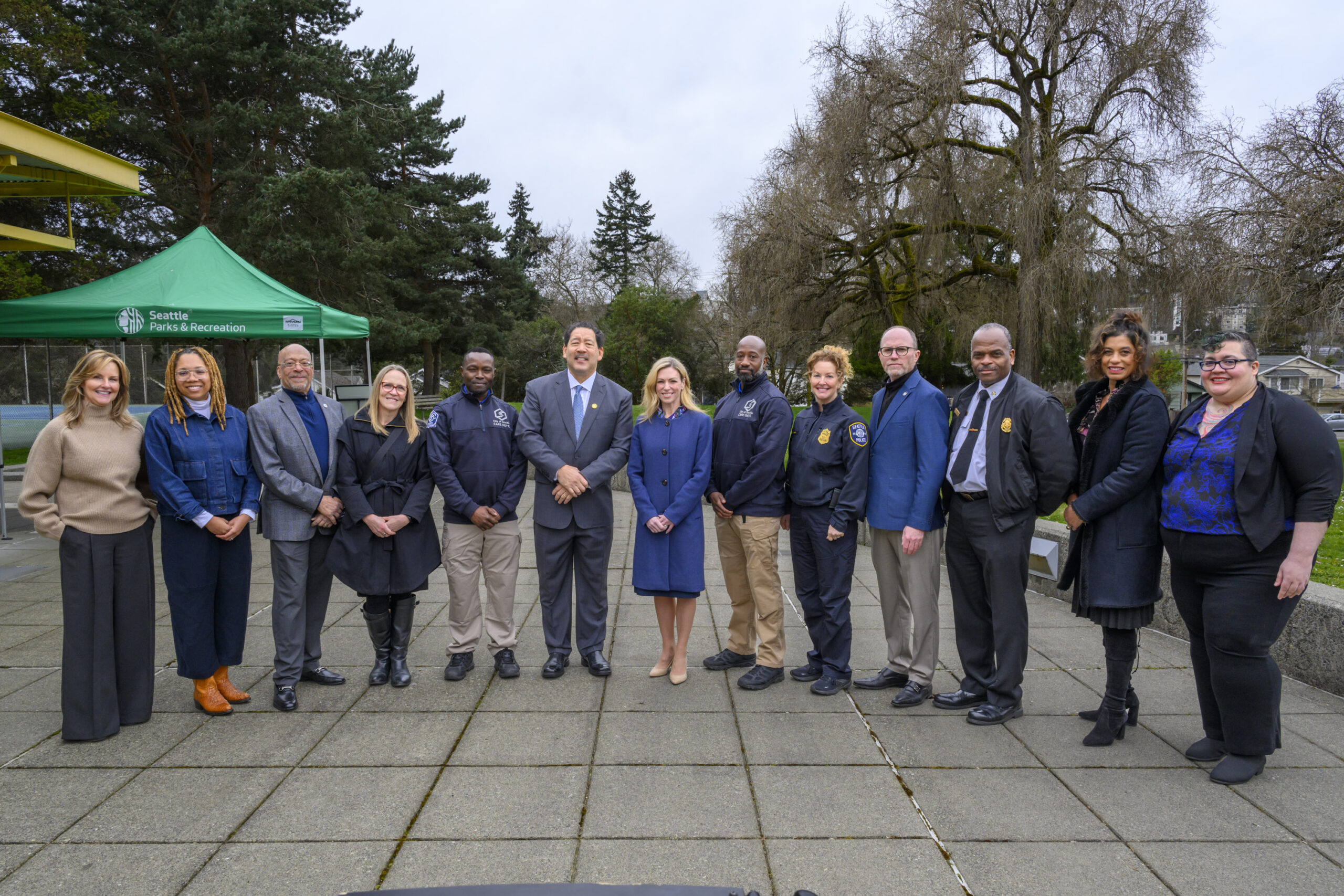 Mayor Harrell standing with CARE Chief Amy Barden and other City and community leaders