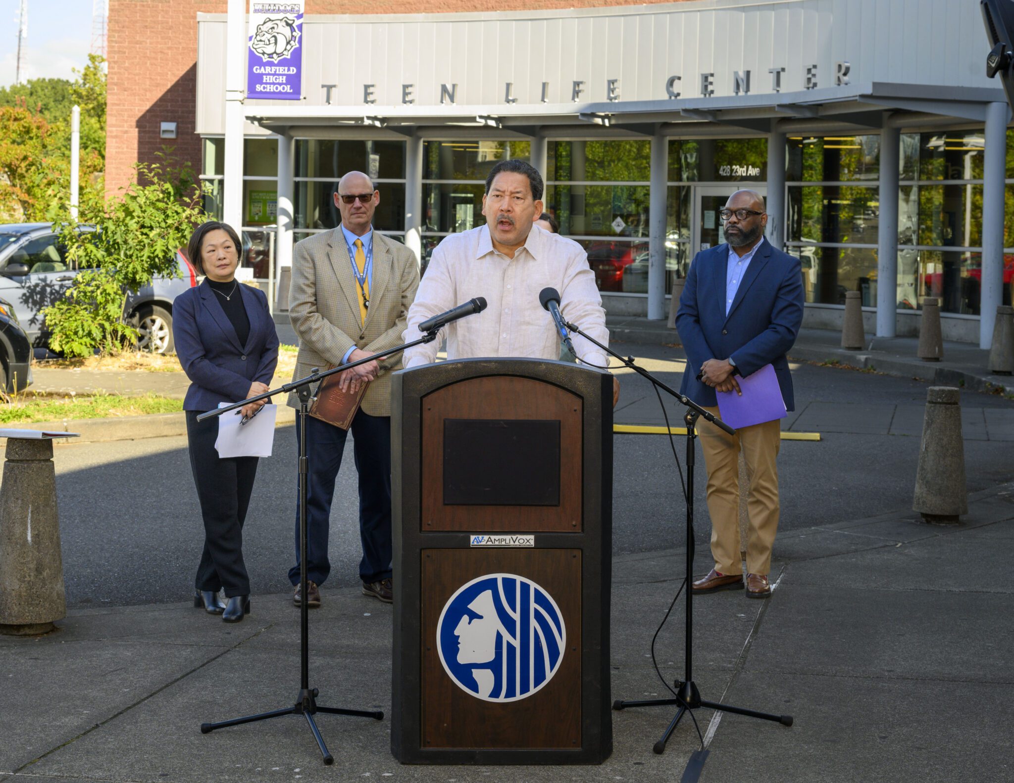 Mayor and partners outside of Garfield High School Teen Life Center speaking at press conference