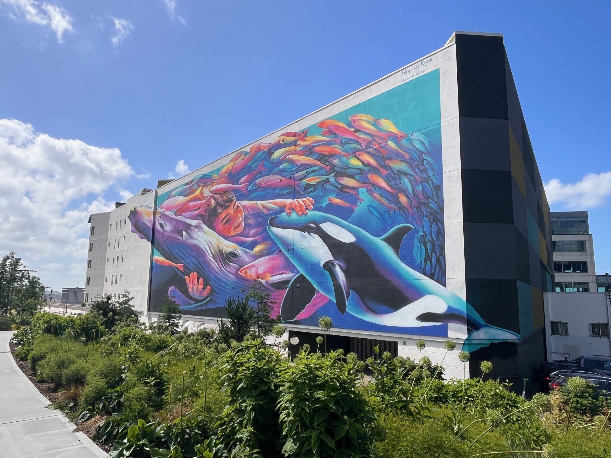 Generation Restoration mural of whales on waterfront